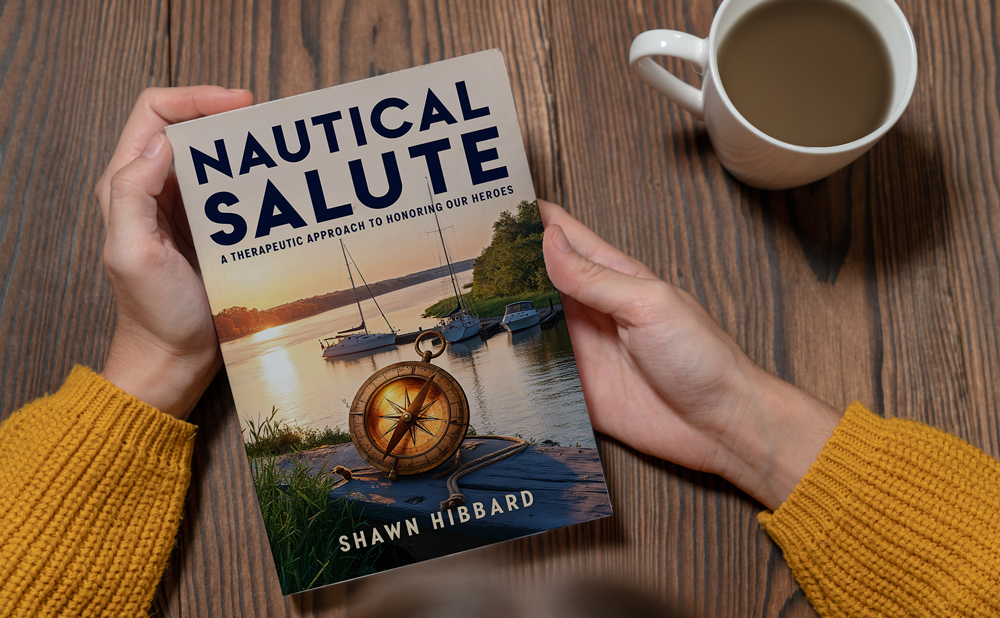 Nautical Salute Book in a woman's hands on a table