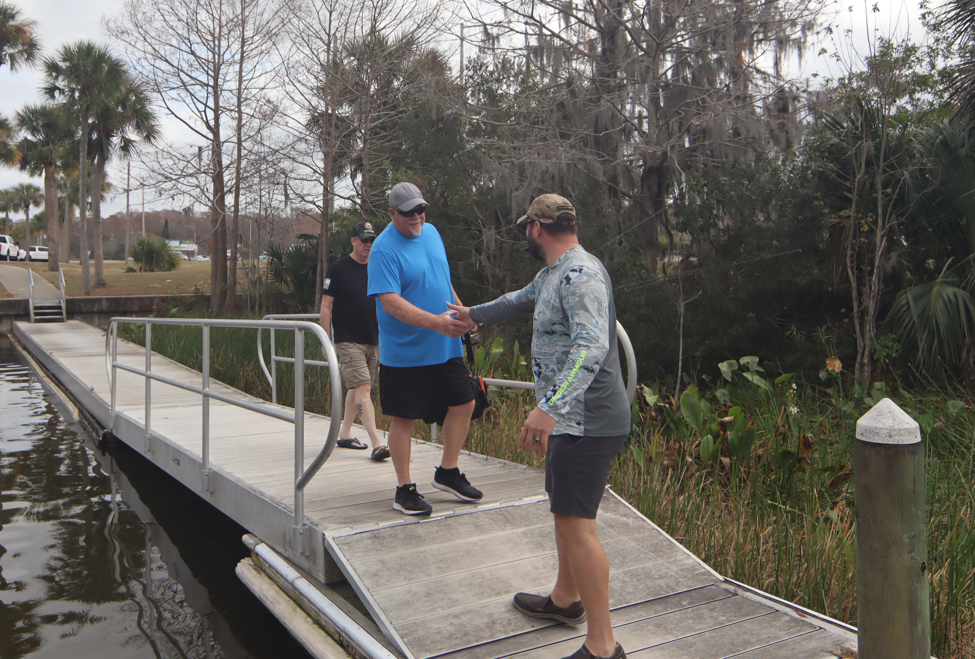 Veterans greeting each other at the dock